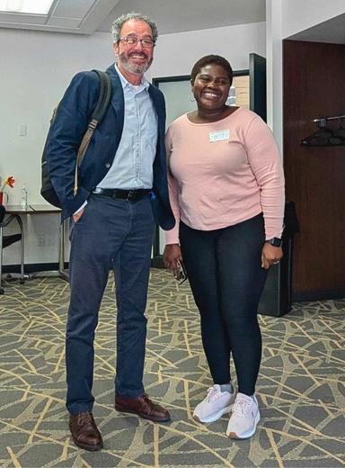 Dr. Azevedo stands next to one of our graduate students at an Unbound reception.